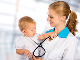 Paediatric surgeon holding a child